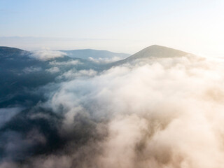 Fototapeta premium Morning fog in the Ukrainian Carpathians. Aerial drone view.