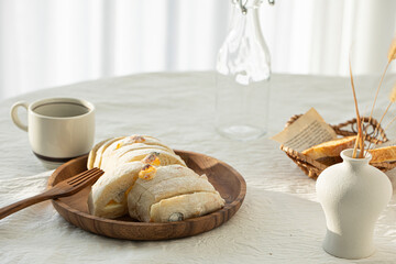ciabatta with a wooden tray on a white table