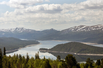 Beautiful landscape scenery with lake mountains and forest.