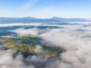 Morning fog in the Ukrainian Carpathians. Aerial drone view.