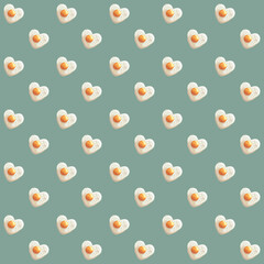 Cartoon seamless fried egg pattern on a green-blue background. Illustration of a vector texture.