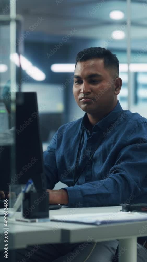 Aufkleber Vertical Screen. Night Office: Portrait of Handsome Indian Man in Working on Desktop Computer. Digital Entrepreneur Typing, Creating Software, e-Commerce App Design, Programming. Successful Man