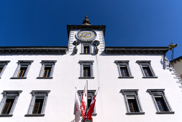 Fototapeta na wymiar Medieval old town of City of Sion with historic city hall and flags on a sunny spring day. Photo taken April 4th, 2022, Sion, Switzerland.