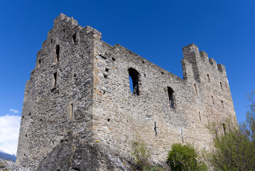 Fototapeta na wymiar Beautiful ruins of medieval Tourbillon Castle on a hill at City of Sion on a sunny spring day. Photo taken April 4th, 2022, Sion, Switzerland.