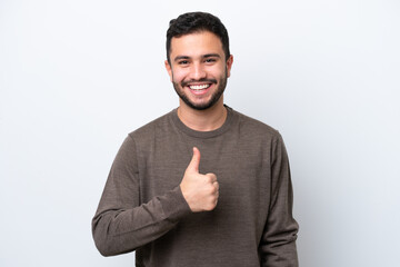 Young Brazilian man isolated on white background giving a thumbs up gesture