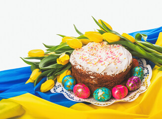 Ukrainian symbols. Easter holiday. Easter cake, colored eggs and tulips on the background of the...