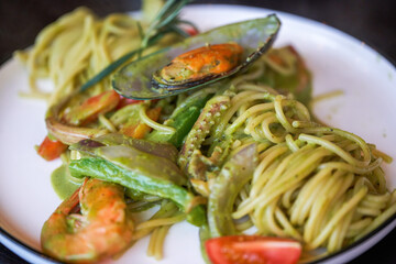 A delicious and delicious western food, seafood pasta with avocado green sauce