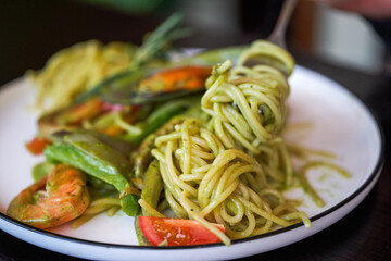 A delicious and delicious western food, seafood pasta with avocado green sauce
