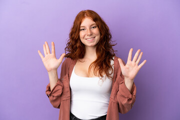 Teenager redhead girl over isolated purple background counting ten with fingers