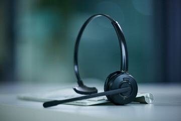 Were always ready to be of assistance. Closeup shot of a headset lying on a keyboard in an office.