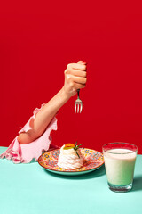 Food pop art photography. Cropped portrait of woman tasting sweet cake with grapefruit on bright...