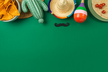 Cinco de Mayo holiday background with Mexican cactus, nachos chips, maracas and party sombrero hat....