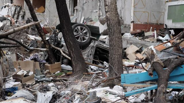 Chernihiv Ukraine 2022: 
a civilian car under the ruins of a destroyed building as a result of an air attack. Result of rocket or artillery shelling by Russian Federation army. War in Ukraine
