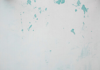 Photography of a painted surface with a paint stain. Texture and wallpaper.