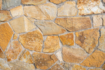 Golden natural stone wall texture