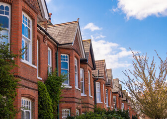 Fototapeta na wymiar Typical British red brick terraced houses in West London 