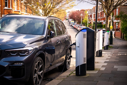 An electric car on-street charging on residential street