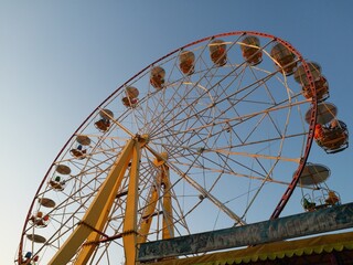 A large Ferris wheel on a blue sky background