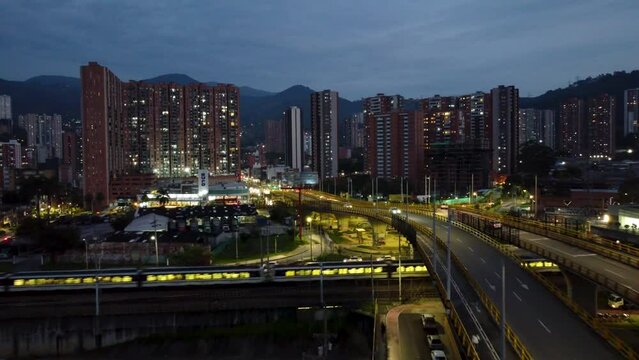 View of the Medellin city metro passing a station at night. nightlife in the city