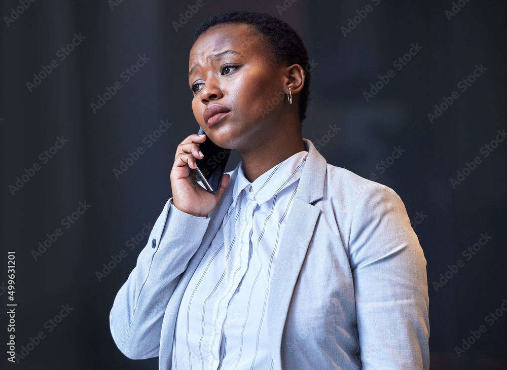 Poster from fear can come courage. shot of a young woman using her phone at work.