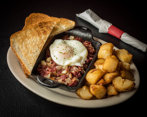 Plated Corned Beef and Hash with Toast 