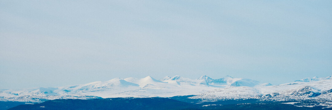 Rondane Mountains in Rondane National Park, Oppland, Norway, covered with snow.