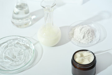 Fototapeta na wymiar laboratory dishes and glassware on a lab table. fermentation, fermented beauty skin care. cream or serum for anti age treatment, powder cosmetic ingredient.