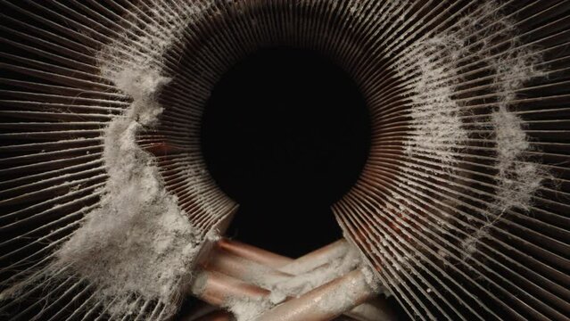 Copper computer heatsink. A lot of dust. Dolly slider extreme close-up inside. Laowa Probe