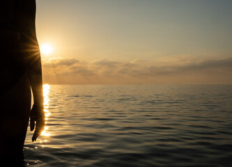 Fototapeta premium The girl stands on the seashore