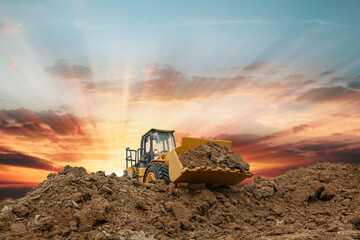 Selective focus with bucket,Wheel loader are digging the soil in the construction site on the...