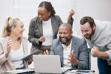 Yes, we did it. Cropped shot of a group of white collar businesspeople cheering while gathered around a laptop in the boardroom.