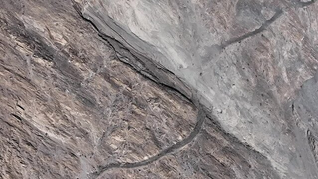 Aerial Birds Eye View Of Old Silk Road Route Across Remote Valley Region In Pakistan