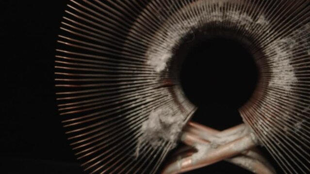 Copper computer heatsink. A lot of dust. Dolly slider extreme close-up inside. Laowa Probe