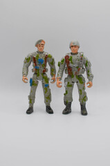 two toy soldiers on a white background