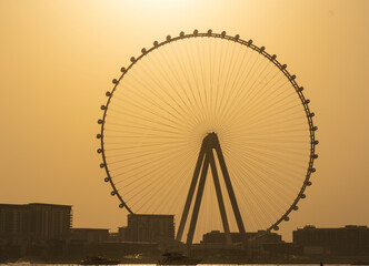 Dubai, United Arab Emirates. Amazing aerial view of the Ain Dubai at sunset. The world’s tallest and largest observation wheel. An iconic landmark close to Dubai Marina