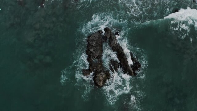 Top down View Of Waves Crashing On Rocks At Puerto Escondido, Oaxaca, Mexico - drone shot