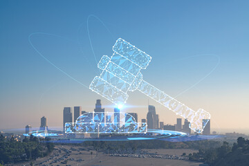 Skyline panorama of Los Angeles downtown at sunset, California, USA. Skyscrapers of LA city. Glowing hologram of legal icons. The concept of law, order, regulations and digital justice.