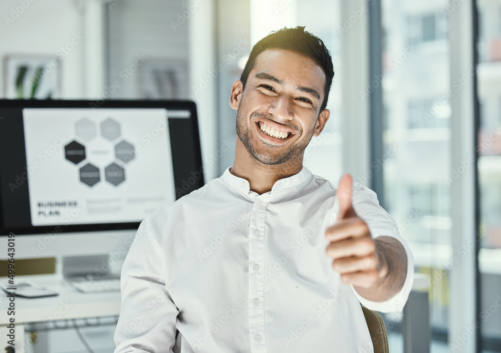 Poster keep going and youll get to where you want to be. shot of a businessman showing thumbs up while sitt