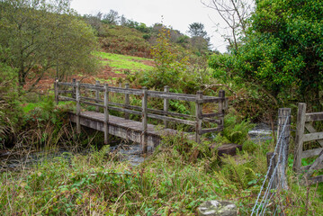 Fototapeta na wymiar Wooden bridge at Devil´s Jump near St Advent in northern Cornwall UK.