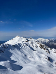 Fototapeta na wymiar Peak of winter mountain