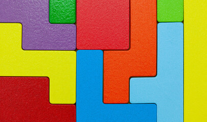 Various colorful shapes of wooden blocks puzzle close-up