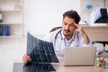 Young male doctor radiologist working in the clinic