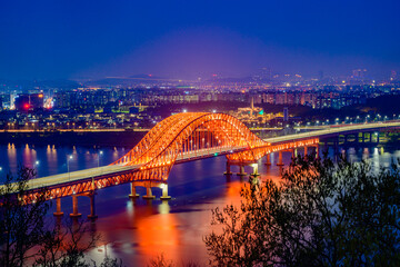 Naklejka na ściany i meble Bridge of Seoul Banghwa bridge beautiful Han river at night, Seoul, South Korea.