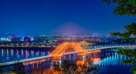 Bridge of Seoul Banghwa bridge beautiful Han river at night, Seoul, South Korea.