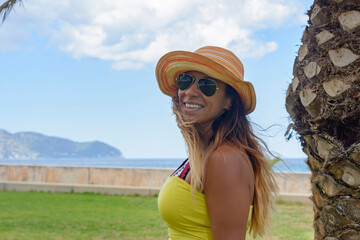 Latin girl portrait, with bikini sunglasses and hat