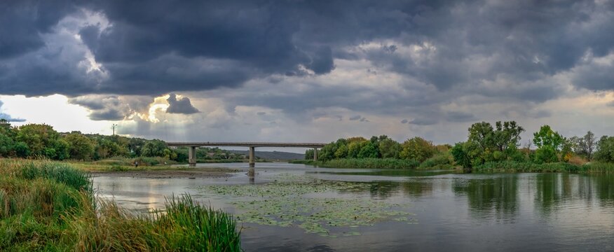 Dark rain clouds over the Southern Bug river