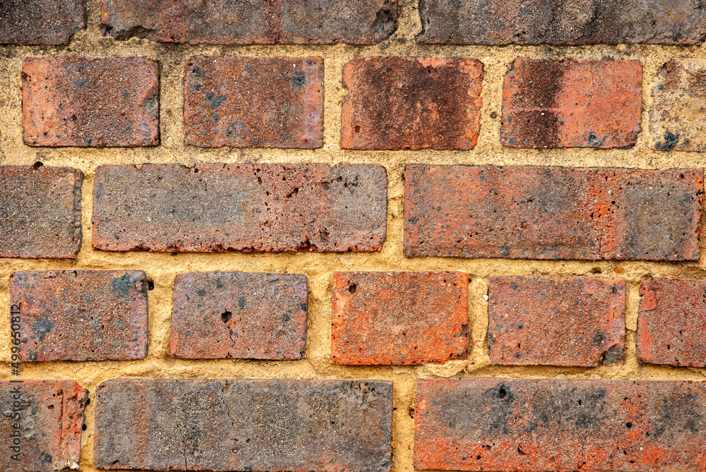 Wall mural old weathered red brick wall closeup as background