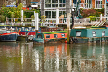 Fototapeta na wymiar Canal narrow houseboats on English canal river