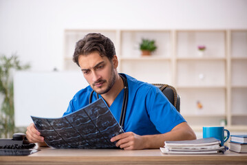 Young male doctor radiologist working in the clinic