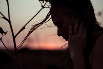 Silhouette of woman dancing in the last light of day in Portugal